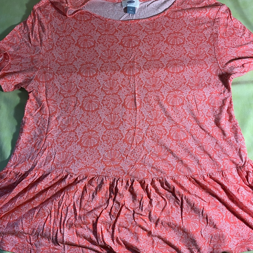 Coral colored top with coral design